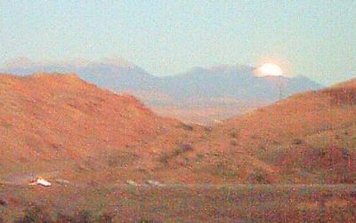 Moon rising over the mountain