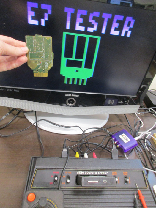 e7 tester title screen with e7 board in front